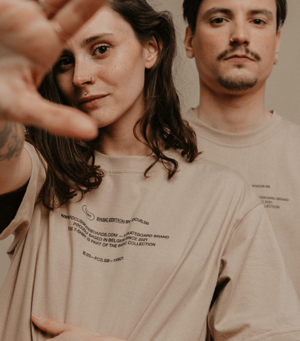 both models wearing brown focus t-shirt looking at camera