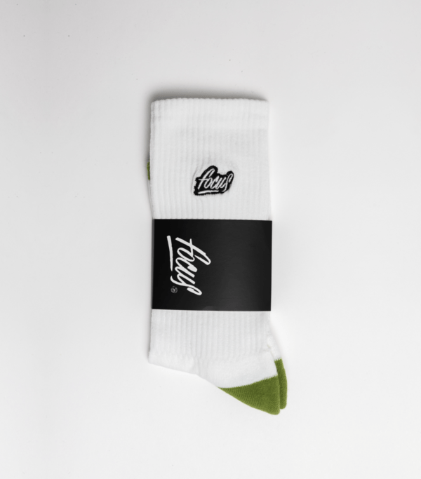 focus white sports socks packaged in black cardboard square