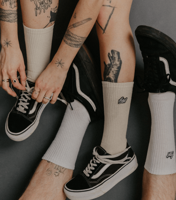 models wearing focus socks crossing legs